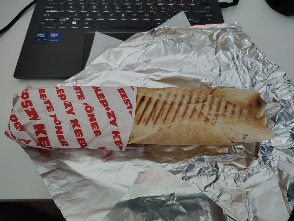 A kebab wrapped in paper and tinfoil