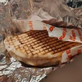 Semi-circle kebab wrapped in tinfoil and paper