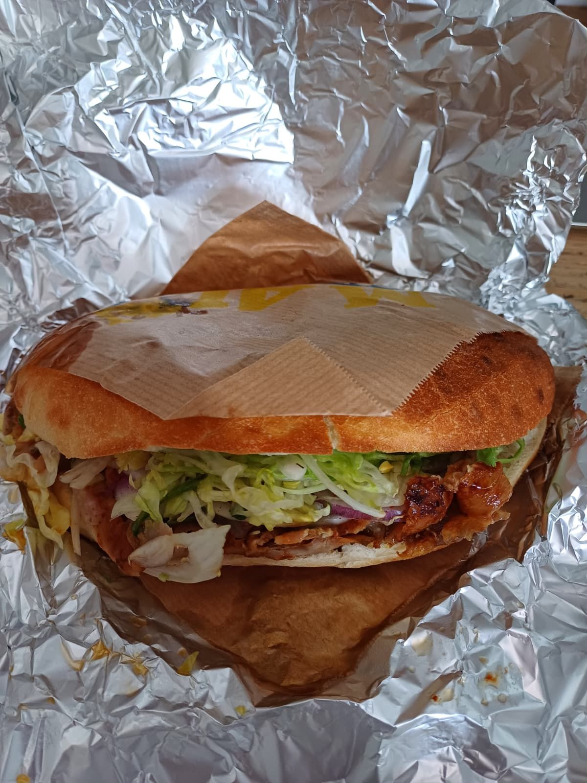 A tasty flatbread kebab showing meet and veggies
