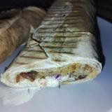 A kebab cut in the middle showing ingredients and juices