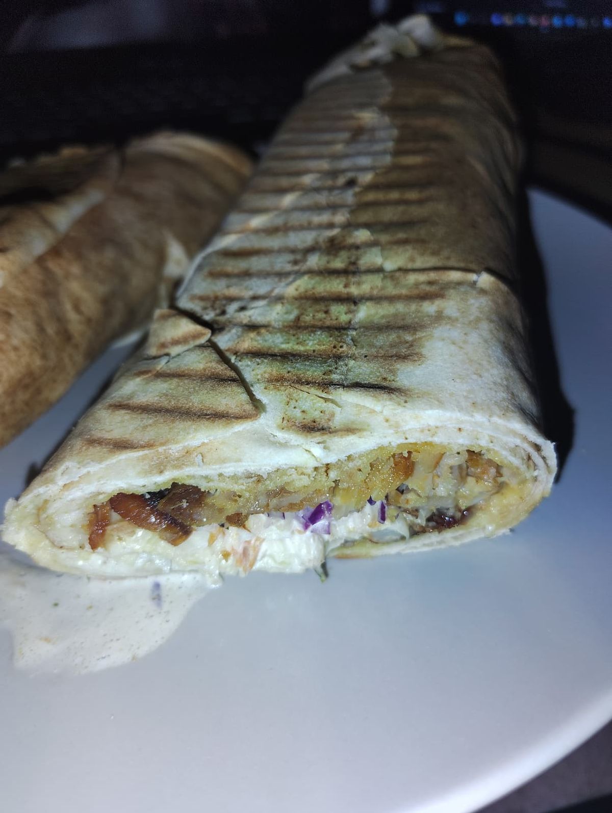 A kebab cut in the middle showing ingredients and juices