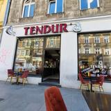 Shop facade showing Tendur in big red letters
