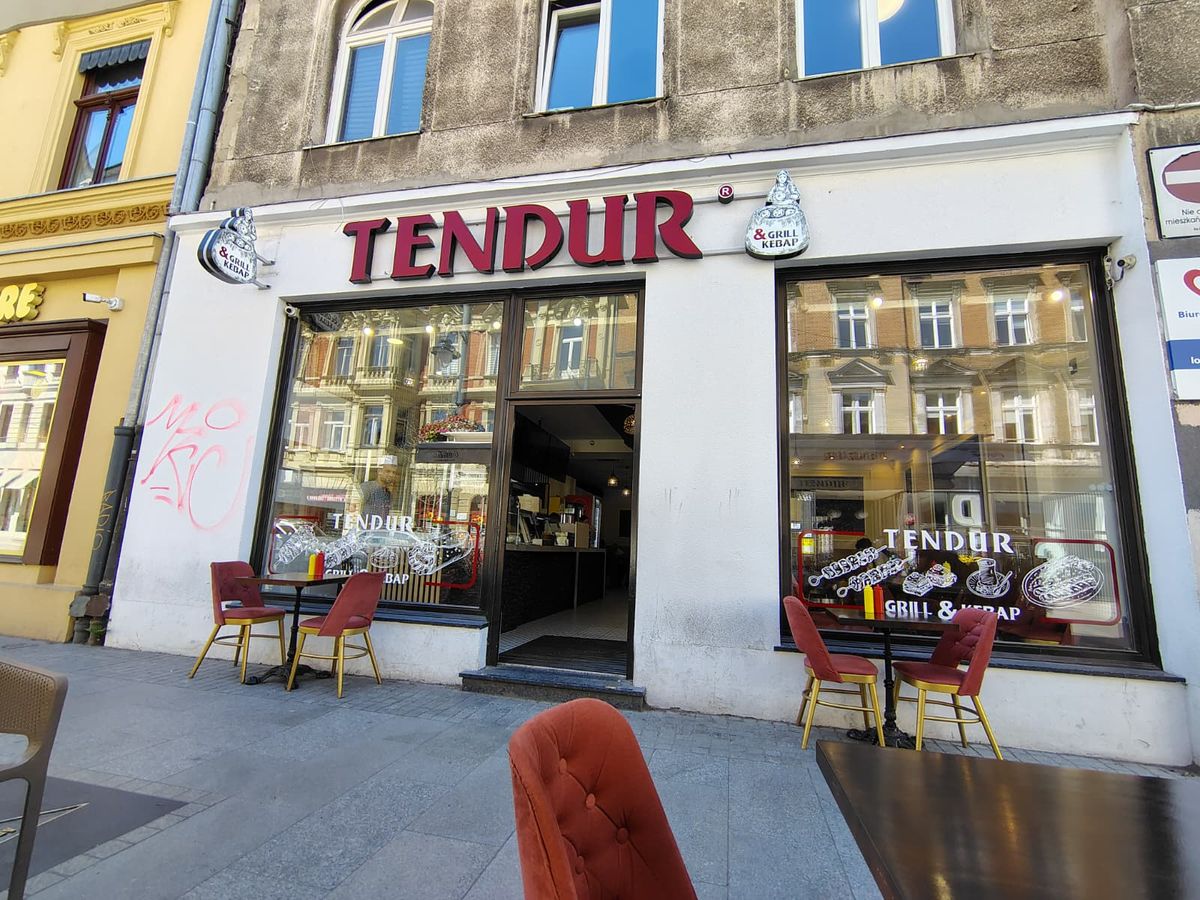Shop facade showing Tendur in big red letters