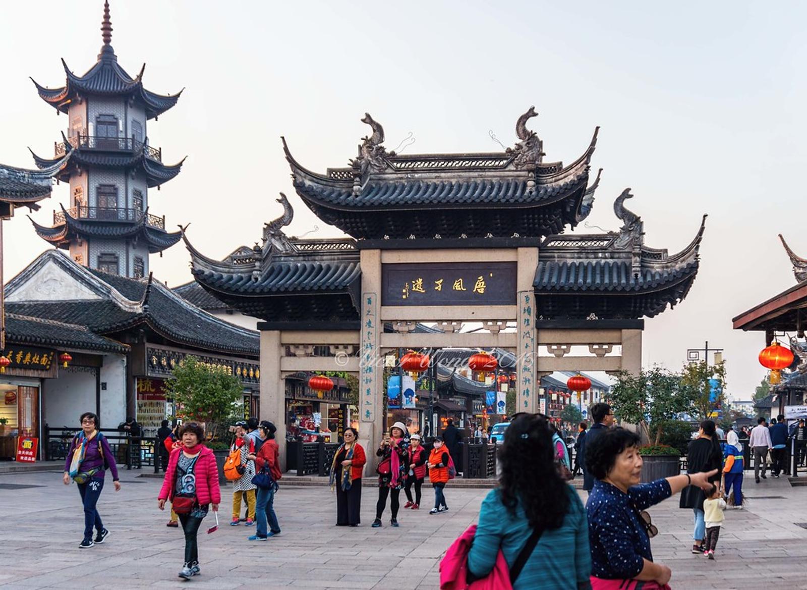 People walking around Zhouzhuang Water Town, Suzhou, China