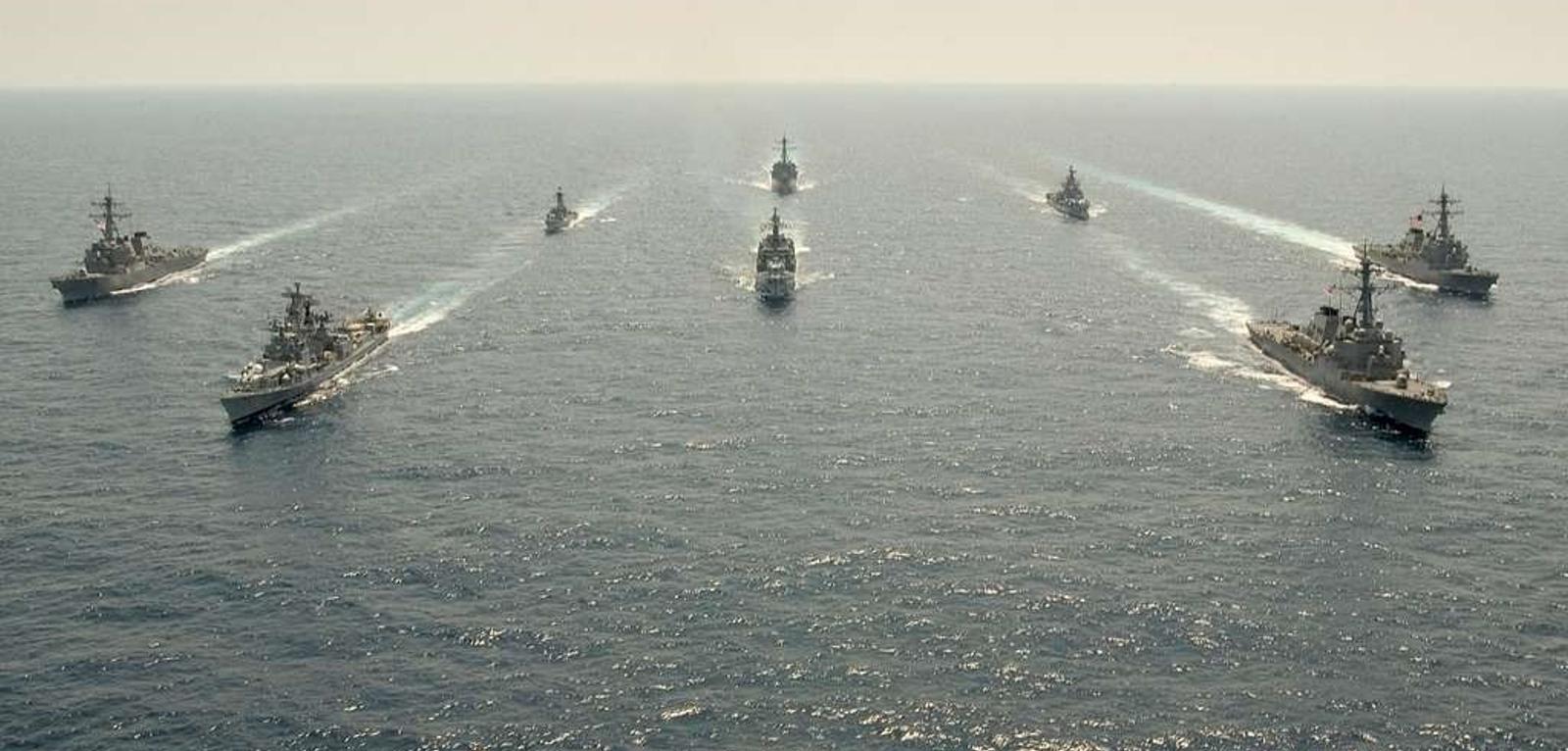 U.S. and Indian Navy ships conduct a formation during Exercise Malabar 07-01 off the coast of Okinawa, Japan