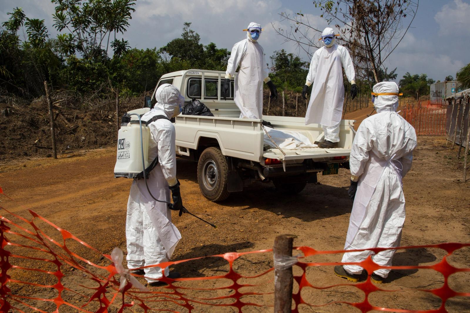 A team of doctors conducts a safe burial in Liberia during the 2014-2016 West Africa Ebola outbreak 