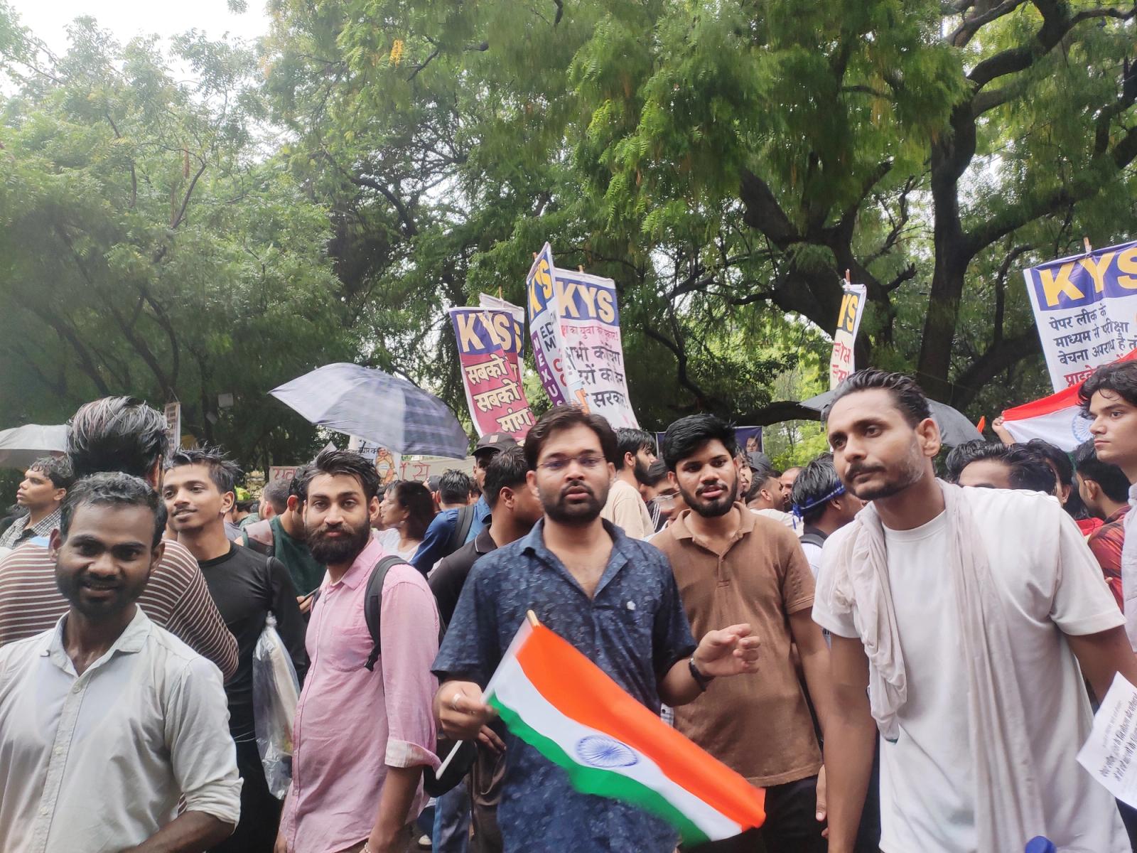 Demonstrators carry India’s national flag at Jantar Mantar, New Delhi's designated protest site, during the exam protests