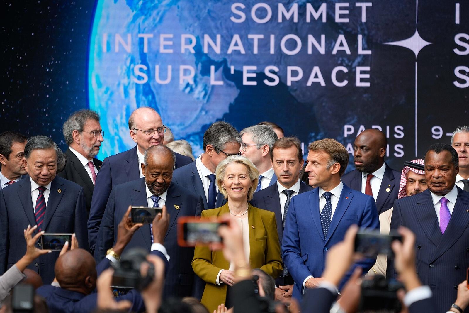 President of the European Commission, Ursula von der Leyern, stands beside French President Emmanuel Macron and other leaders at the International Space Summit in Paris
