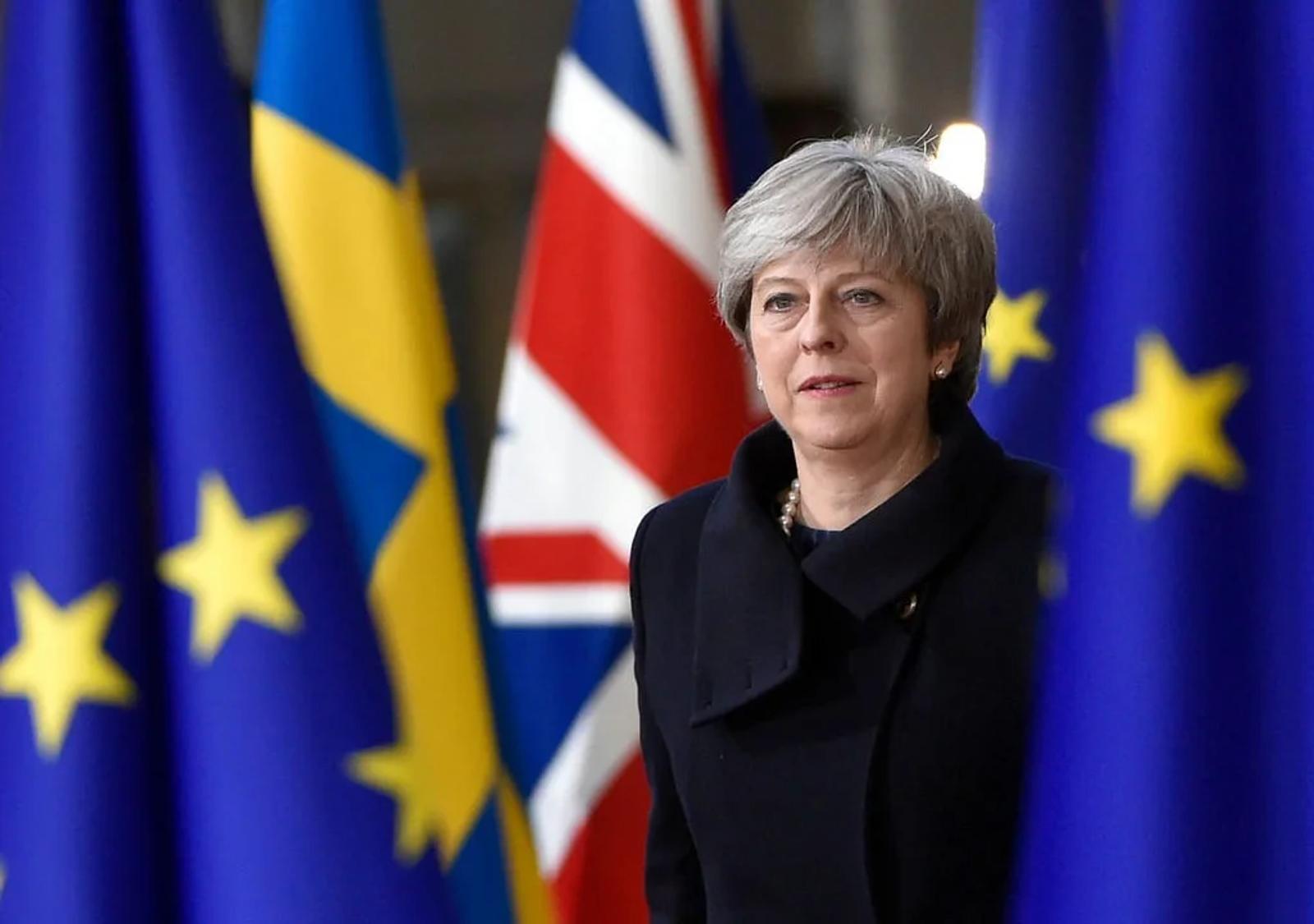 Parliament Torpedoes Brexit Deal, May Hangs On