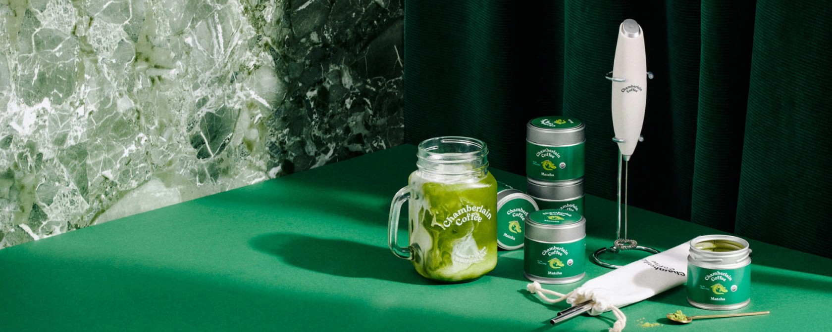 Coffee, matcha and accessories arranged together