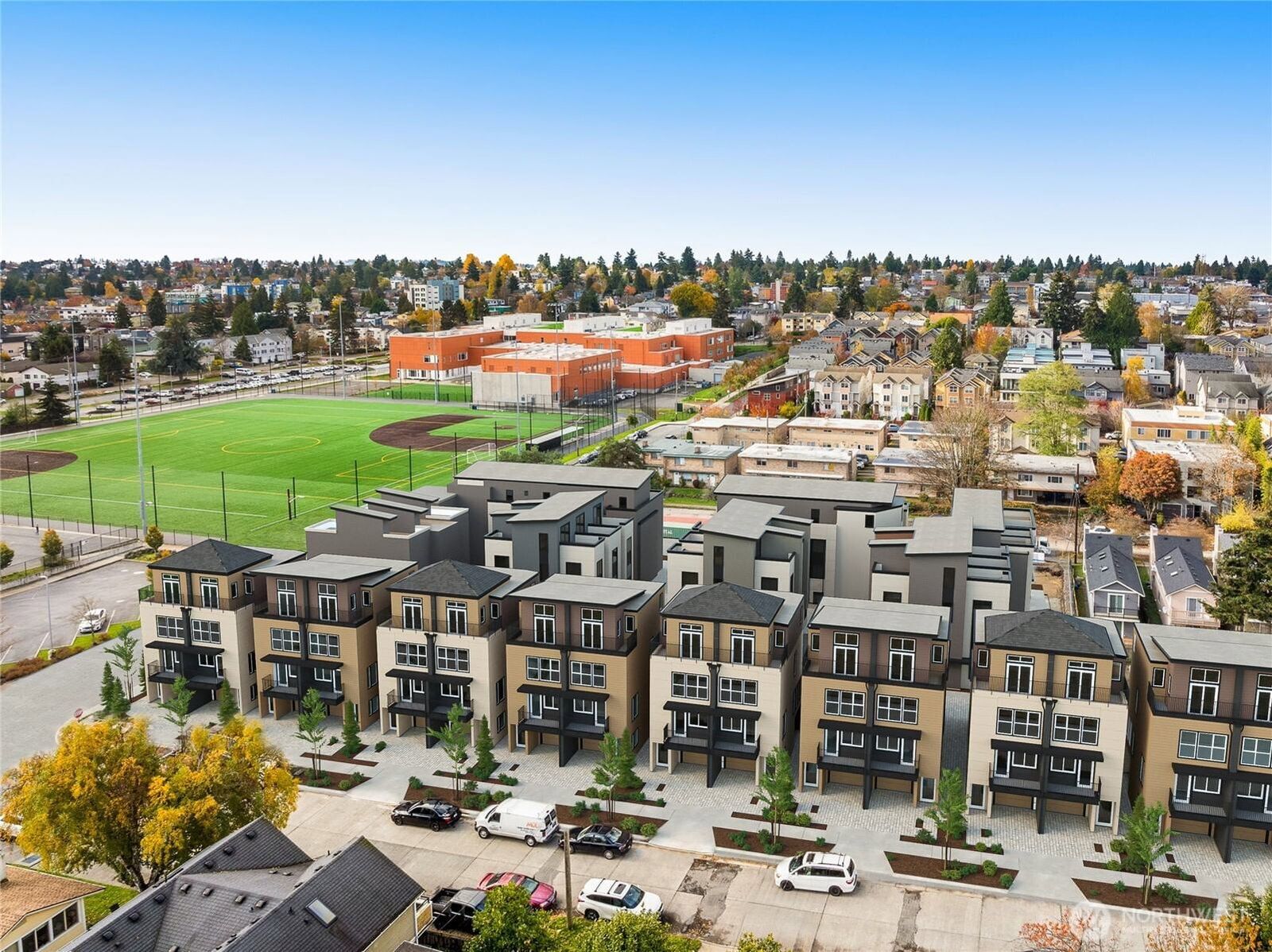 Clover from above: the Densmore Ave N homes with the neighbourhood beyond