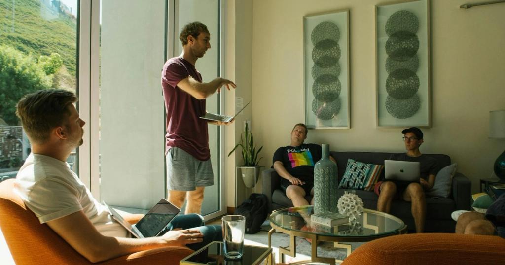 Group of men having a relaxed meeting in a bright, modern living room.