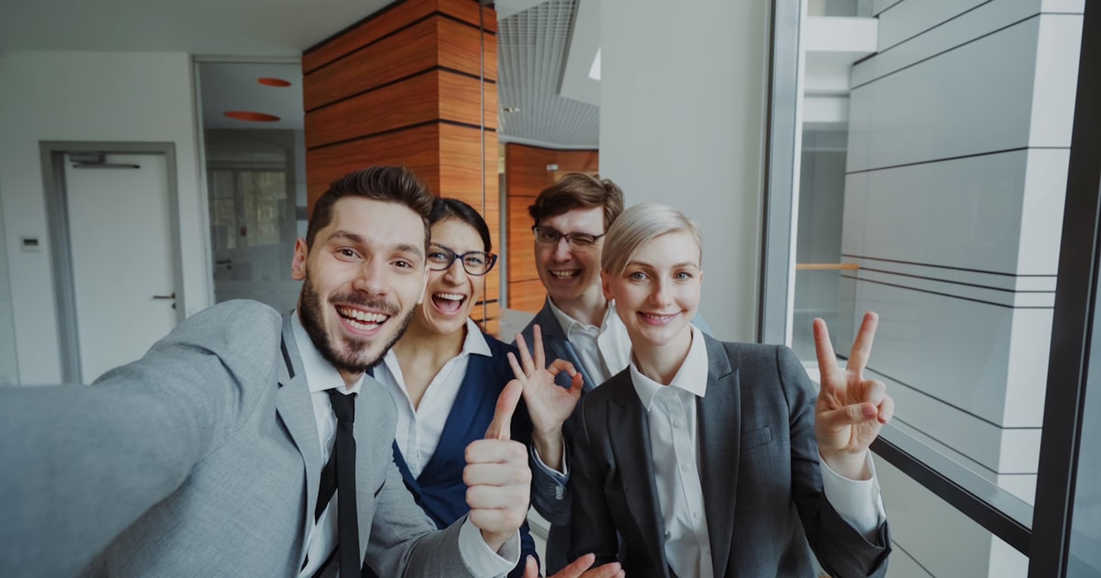Group of happy business people taking a selfie