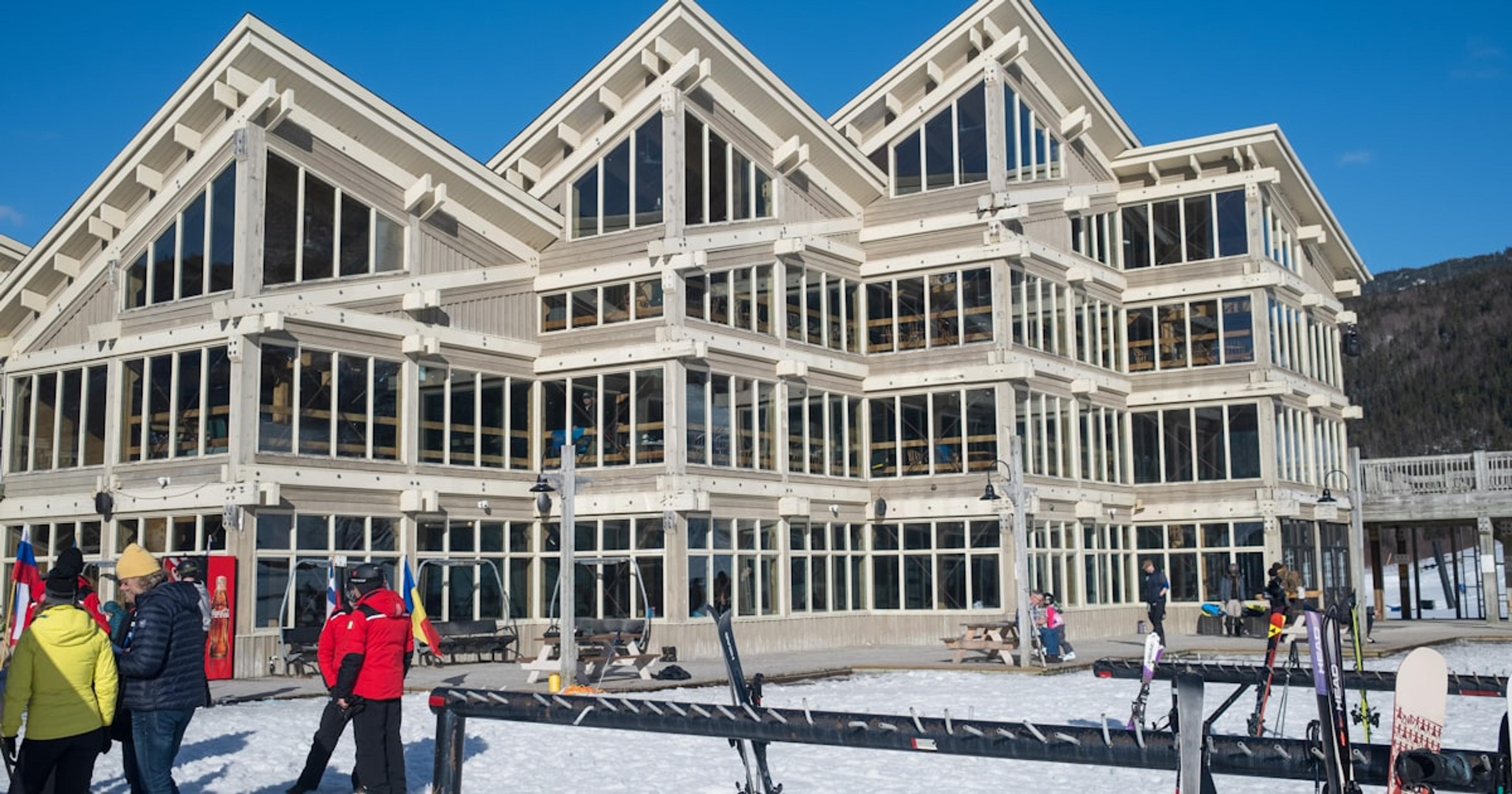 a group of people standing in front of a large building