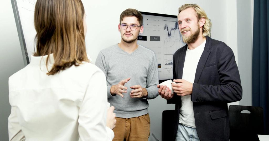 Team of professionals engaging in a lively office discussion about financial data.