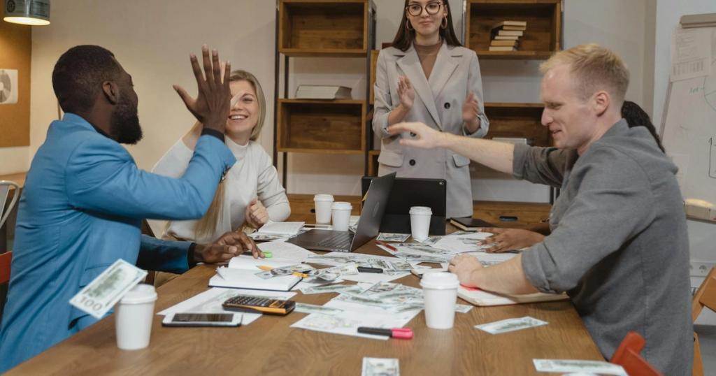 A multicultural team enjoying success during a collaborative business meeting in a modern office.