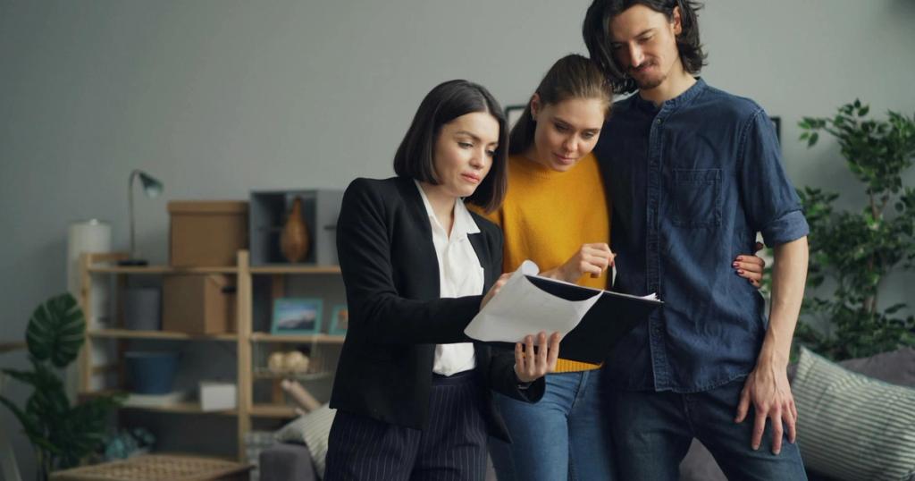 Young couple consulting with a real estate agent about property one indoors.