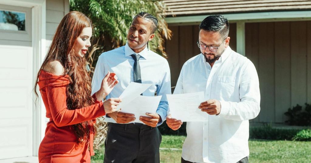 A diverse group evaluates real estate documents outside a residential property in daylight.