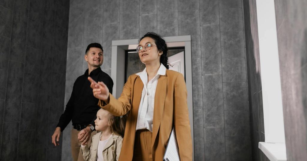 A family explores a modern home interior with a professional realtor guiding them.