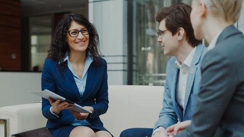 Three business people in a meeting