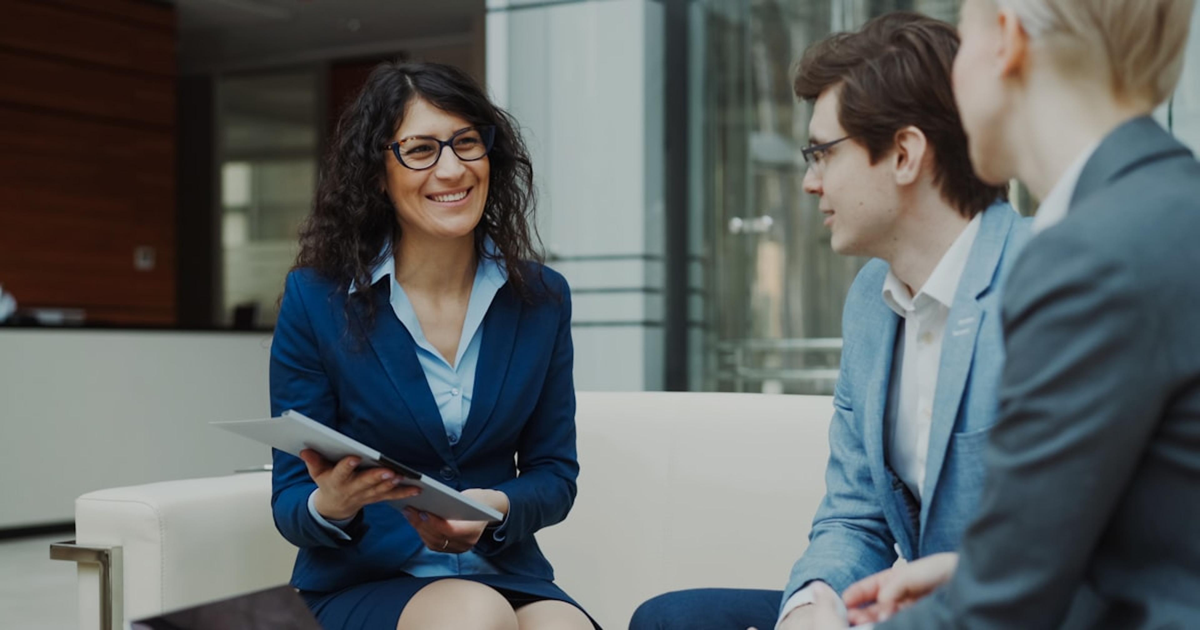Three business people in a meeting