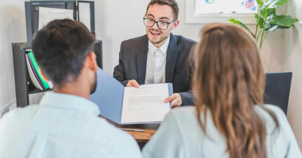 A businessman discusses a contract with clients in a modern office setting.