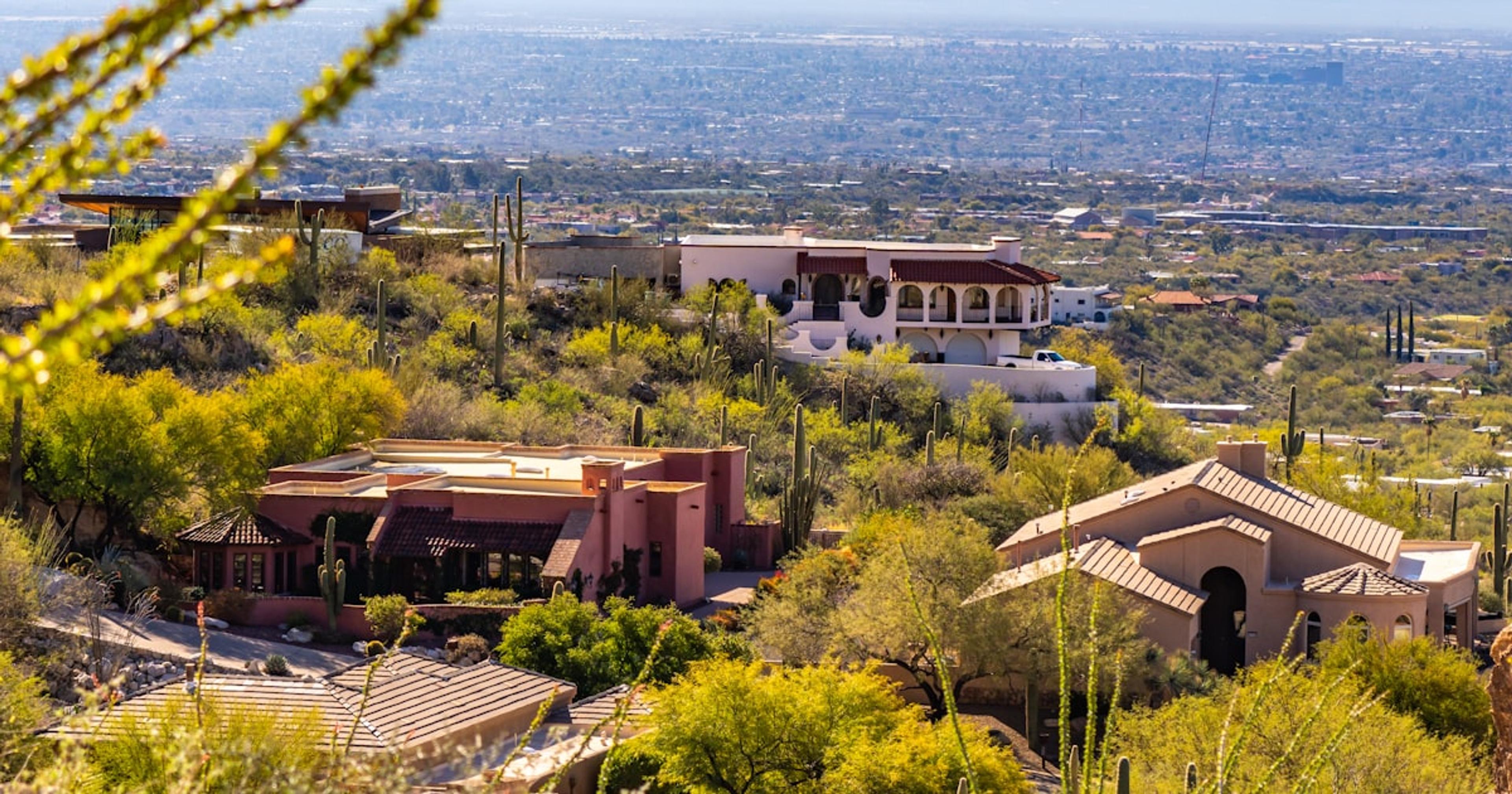 a house on a hill with a view of the city