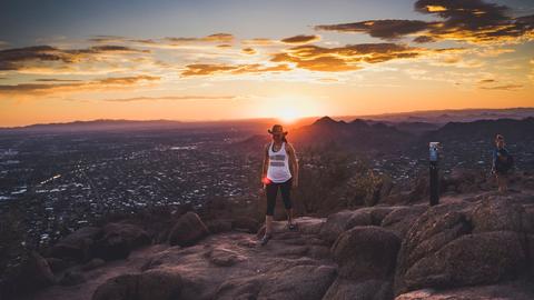 a group of people standing on top of a mountain
