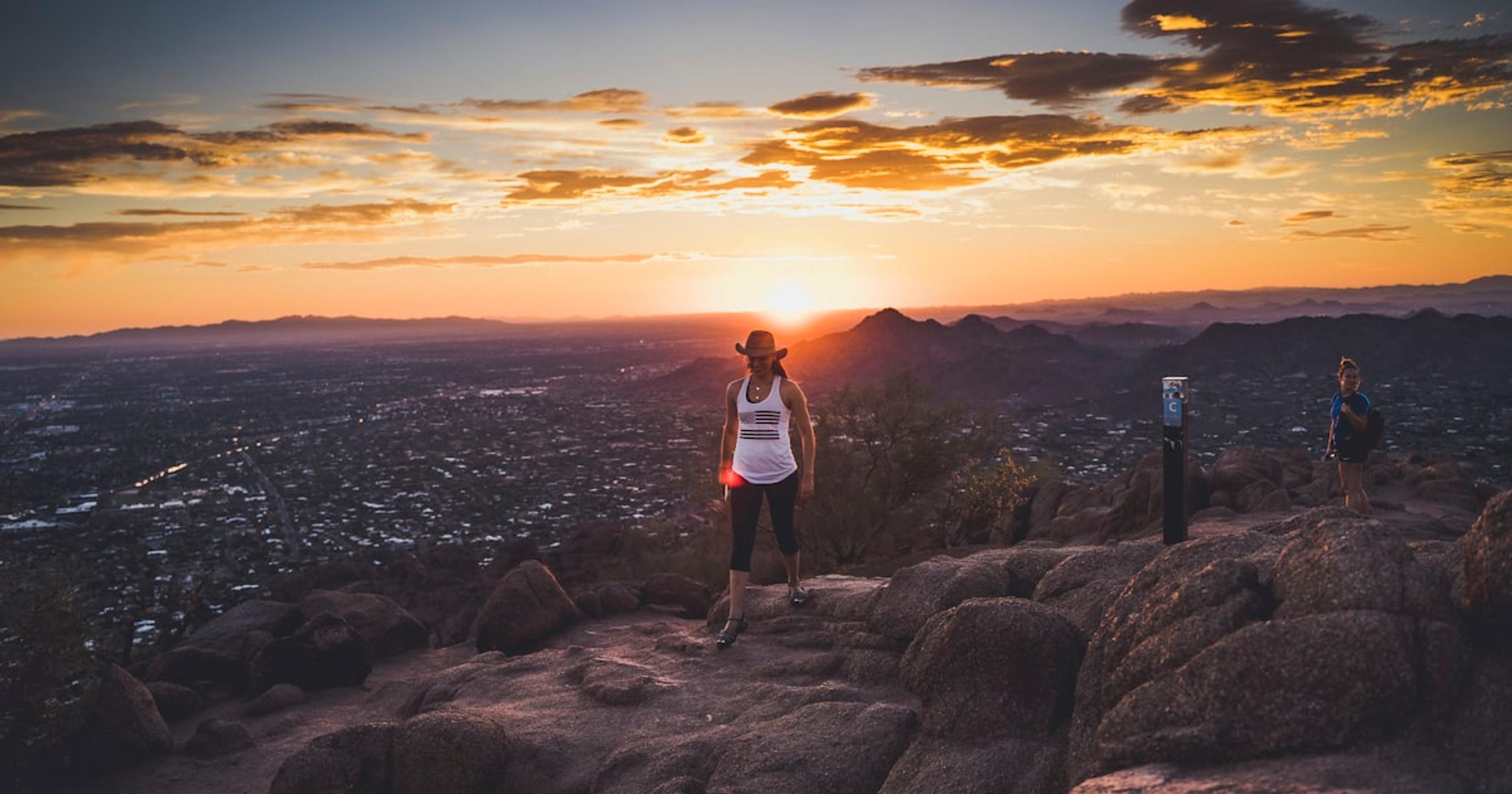 a group of people standing on top of a mountain
