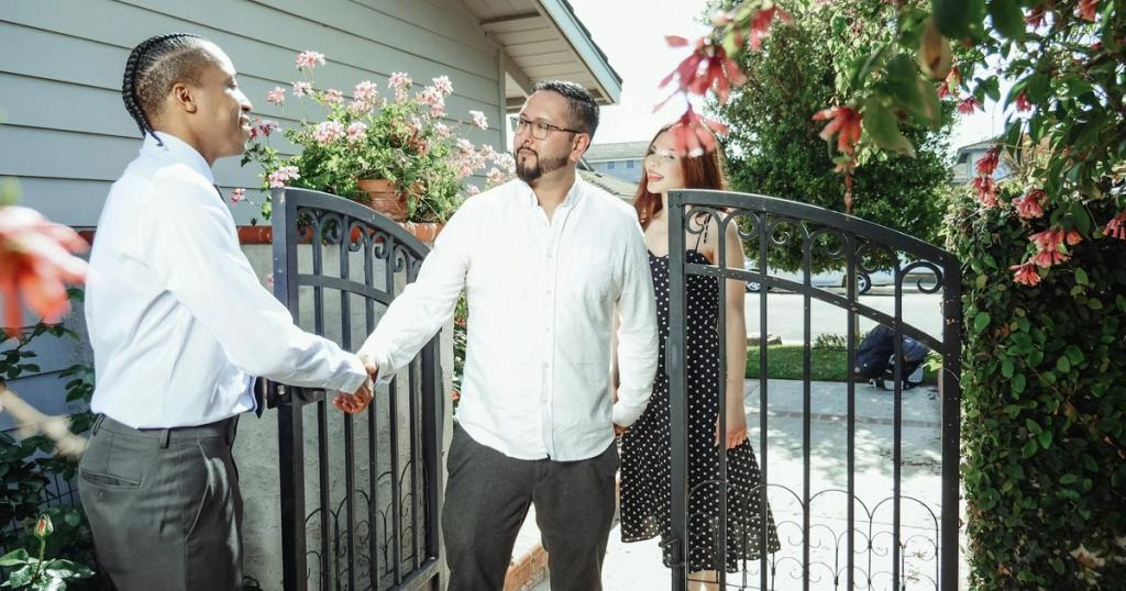 A real estate agent meets a couple at their new home, symbolizing a successful property transaction.