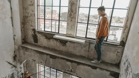 person standing near woman inside building