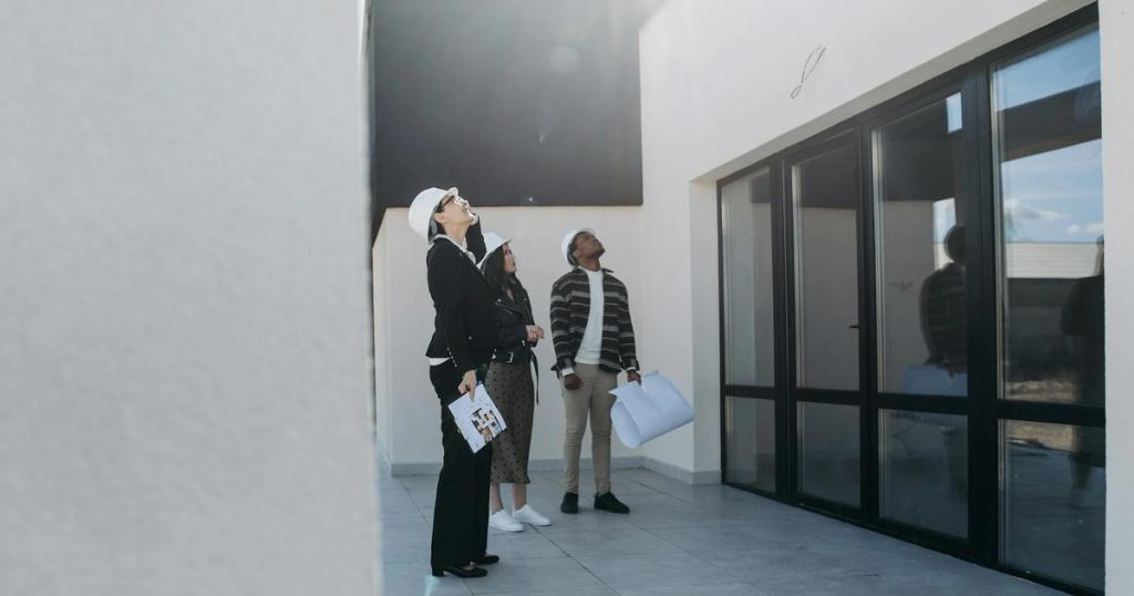 Group of real estate agents assessing a modern building during the day.
