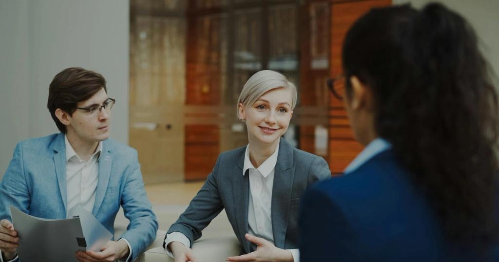 Group of professionals having a discussion in a modern office setting.