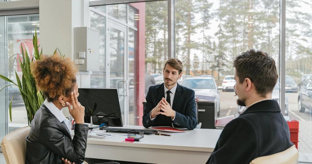 Three adults in a modern office setting having a professional business meeting.