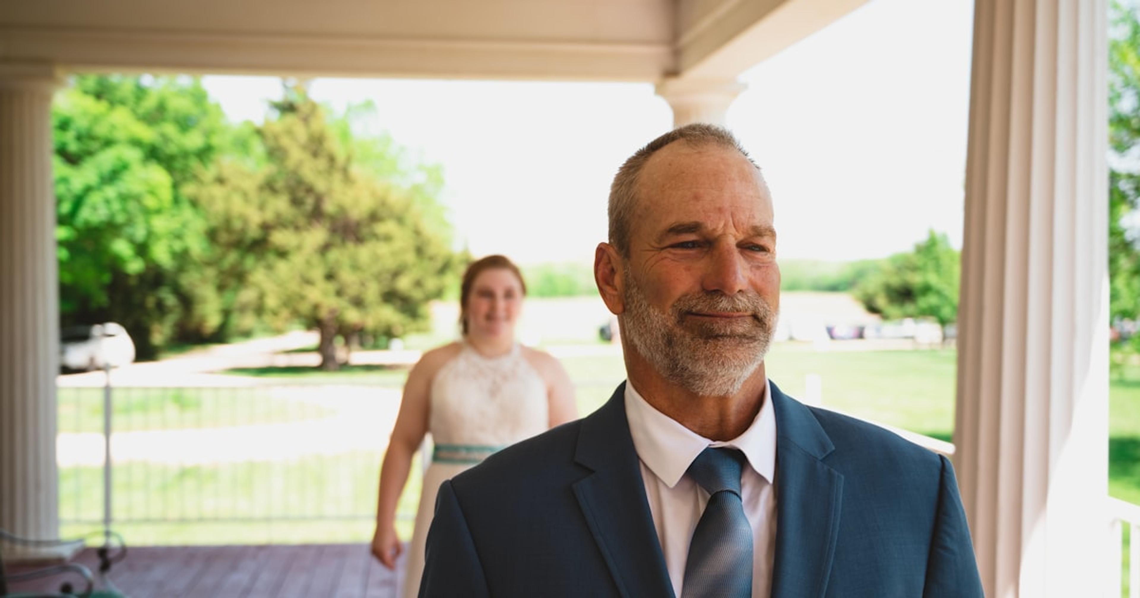 a man in a suit and tie standing next to a woman