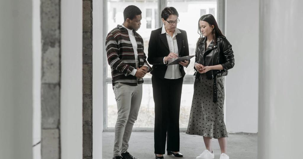 A real estate agent discusses property details with potential buyers during a house viewing.
