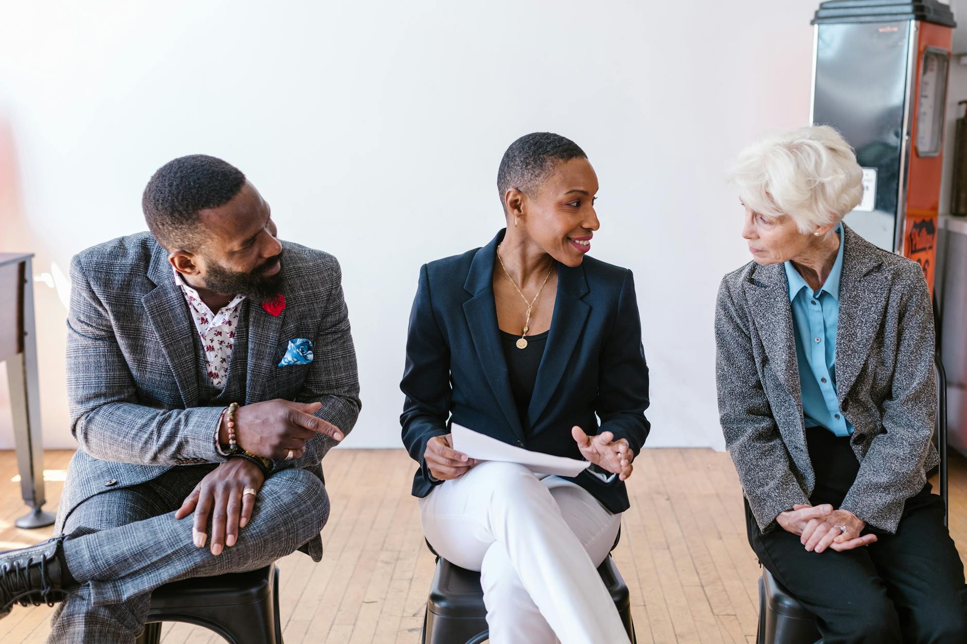 A diverse group of professionals discussing business strategies indoors.