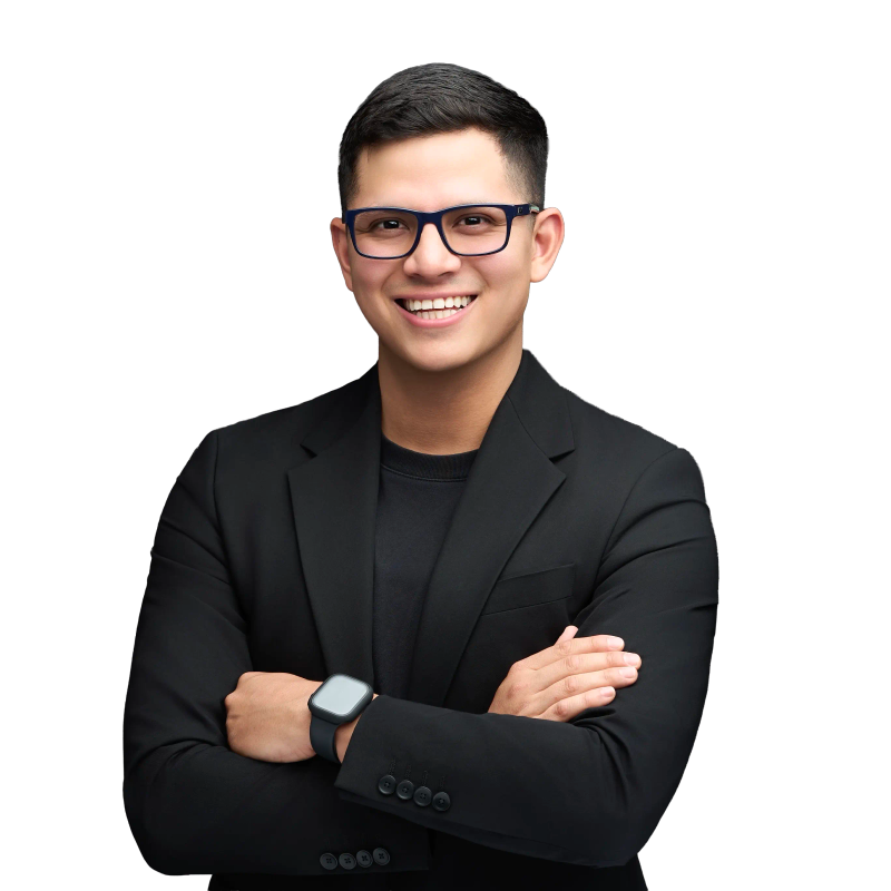 Behind the scenes at a professional headshot session, Christian Gandara adjusting studio lighting in Dallas