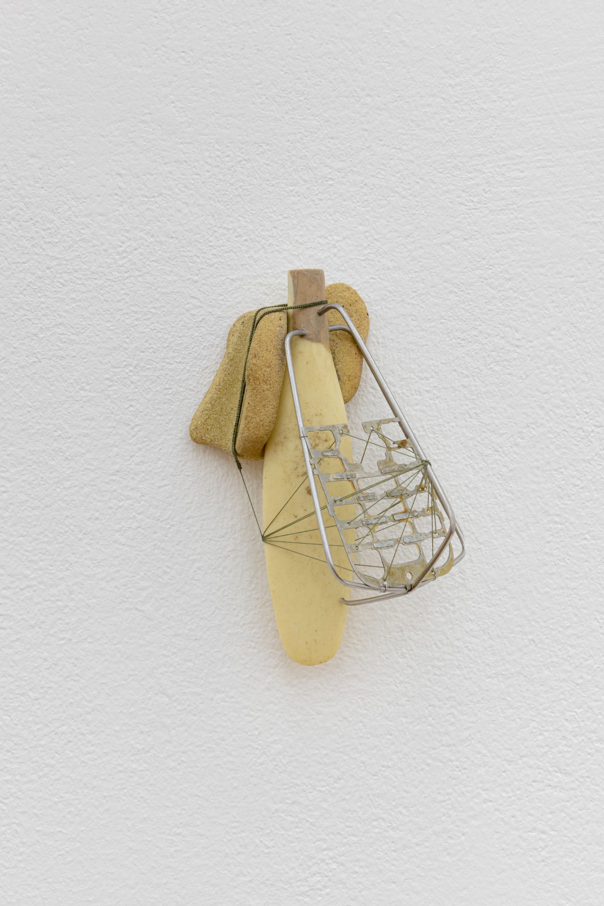 David Fesl, Untitled, 2022, sea mineral, kitchen utensil handle, blender whisk, mobile phone keyboard, silk thread,10.9 × 7.2 × 5.3 cm, photo: Sebastian Kissel
