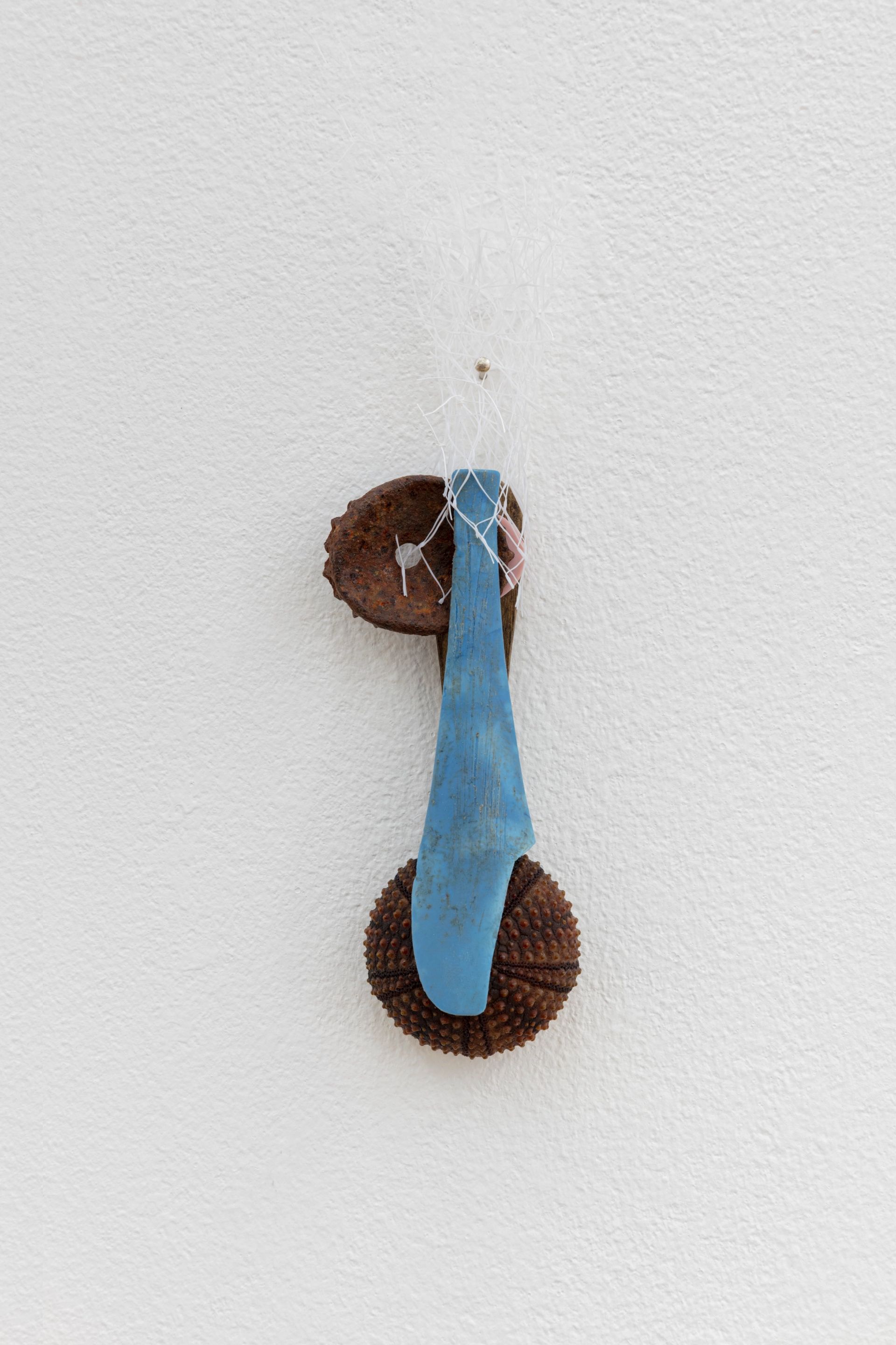 David Fesl, Untitled, 2022, soap sleeve, plastic spoon, popsicle stick, bottle cap, gummy seal, sea urchin shell, 15.4 × 4 × 2 cm, photo: Sebastian Kissel