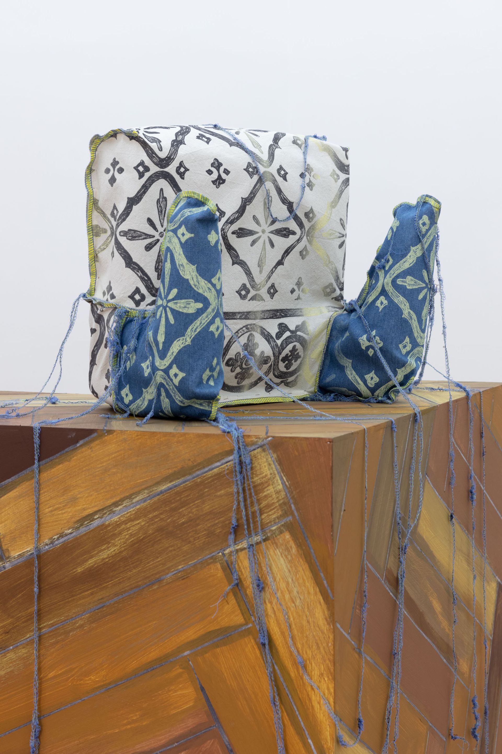 Ana Navas, Tuto de pollo, 2021, Baby car seat, Silkscreen print of industrial textile pattern, 80 × 40 × 40 cm
