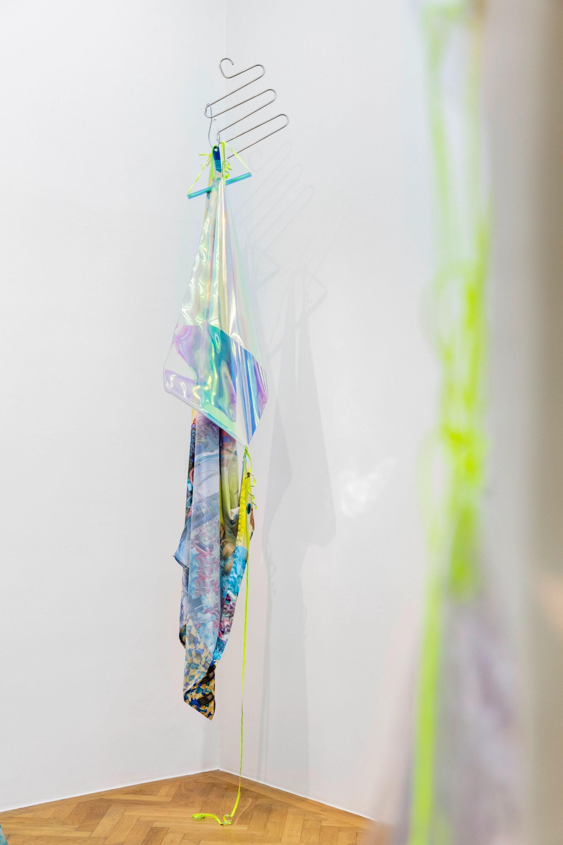 Anna Ehrenstein, Convivial Fiber IV, 2021, Tools for Conviviality, sublimation-print on textiles, pvc, clothing hanger, reflective cord, 190 x 40 x 10 cm