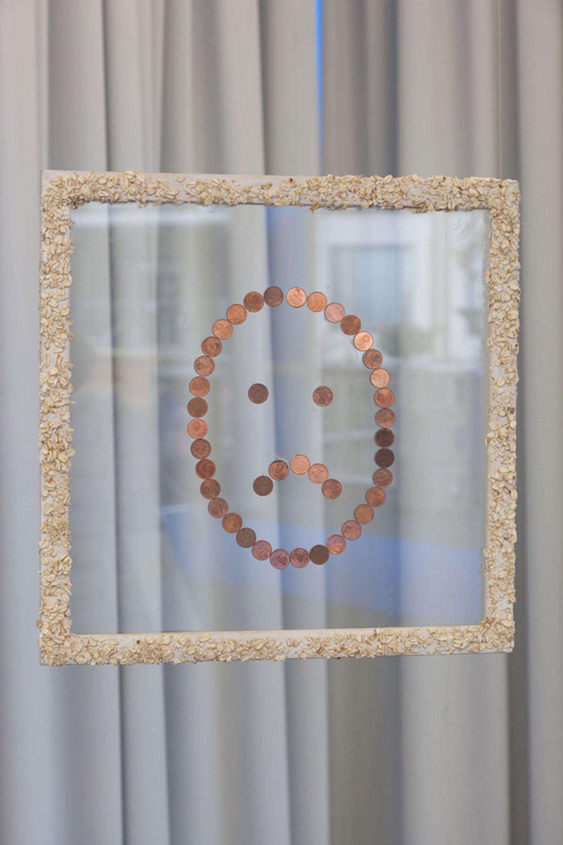 UNHAPPY OATS, oatmeal on wood, glass and cent pieces, 2013