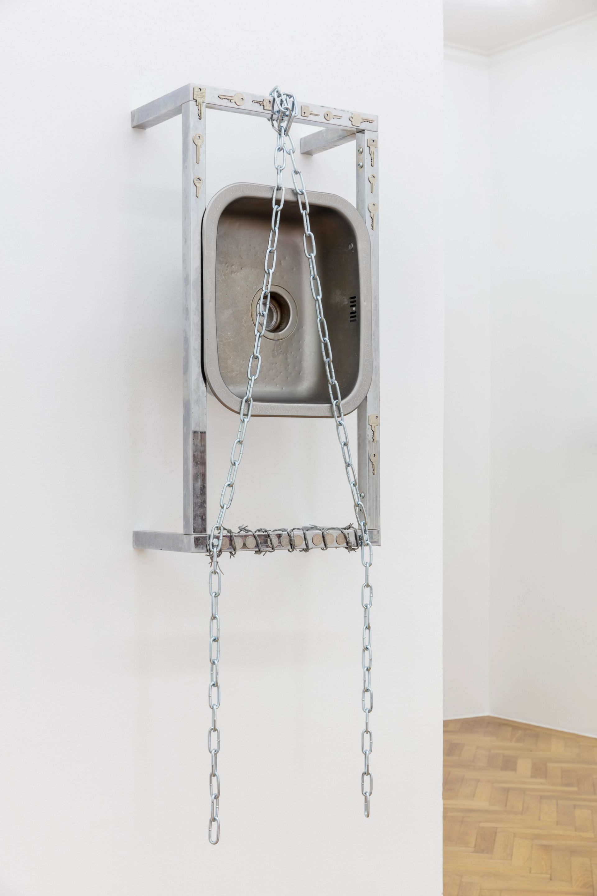 Anna McCarthy, Shackles / Kitchen, 2022, stainless steel, chrome, leather, coins, glue, bolts, wire, keys, 145 x 44.5 x 26.5 cm