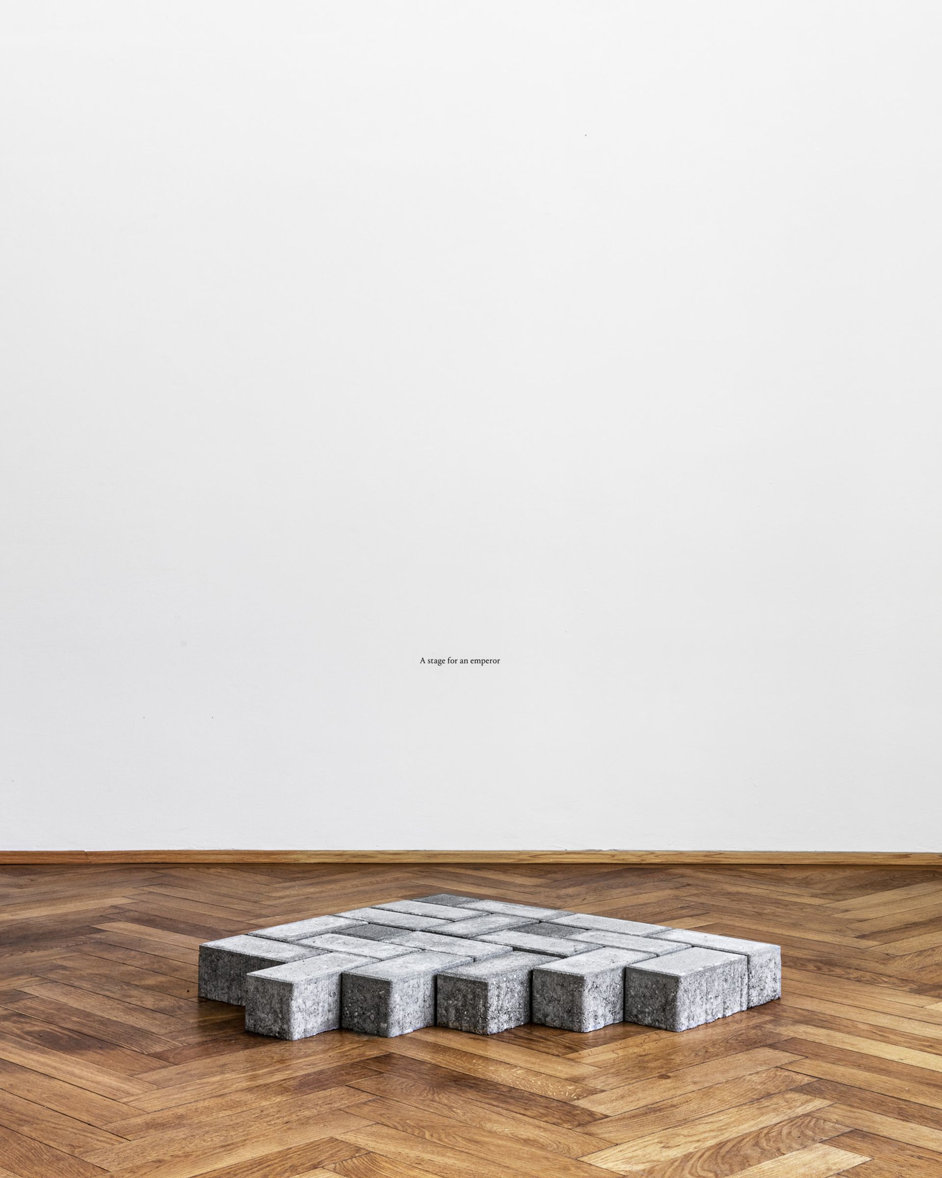 Thomas Geiger, A stage for an emperor, 2017, concrete paving stones, adhesive letters, 70 × 91,5 × 8 cm