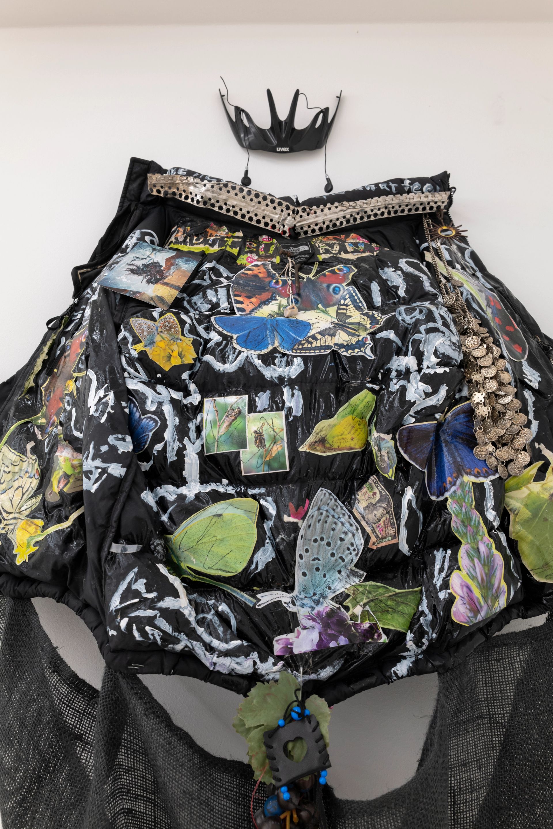 Anna McCarthy, Butterfly, fly away (kite), 2025, acrylic, paper, photograph on Northface jacket, hemp, leather, mixed media, 220 × 140 × 25 cm, dimensions variable