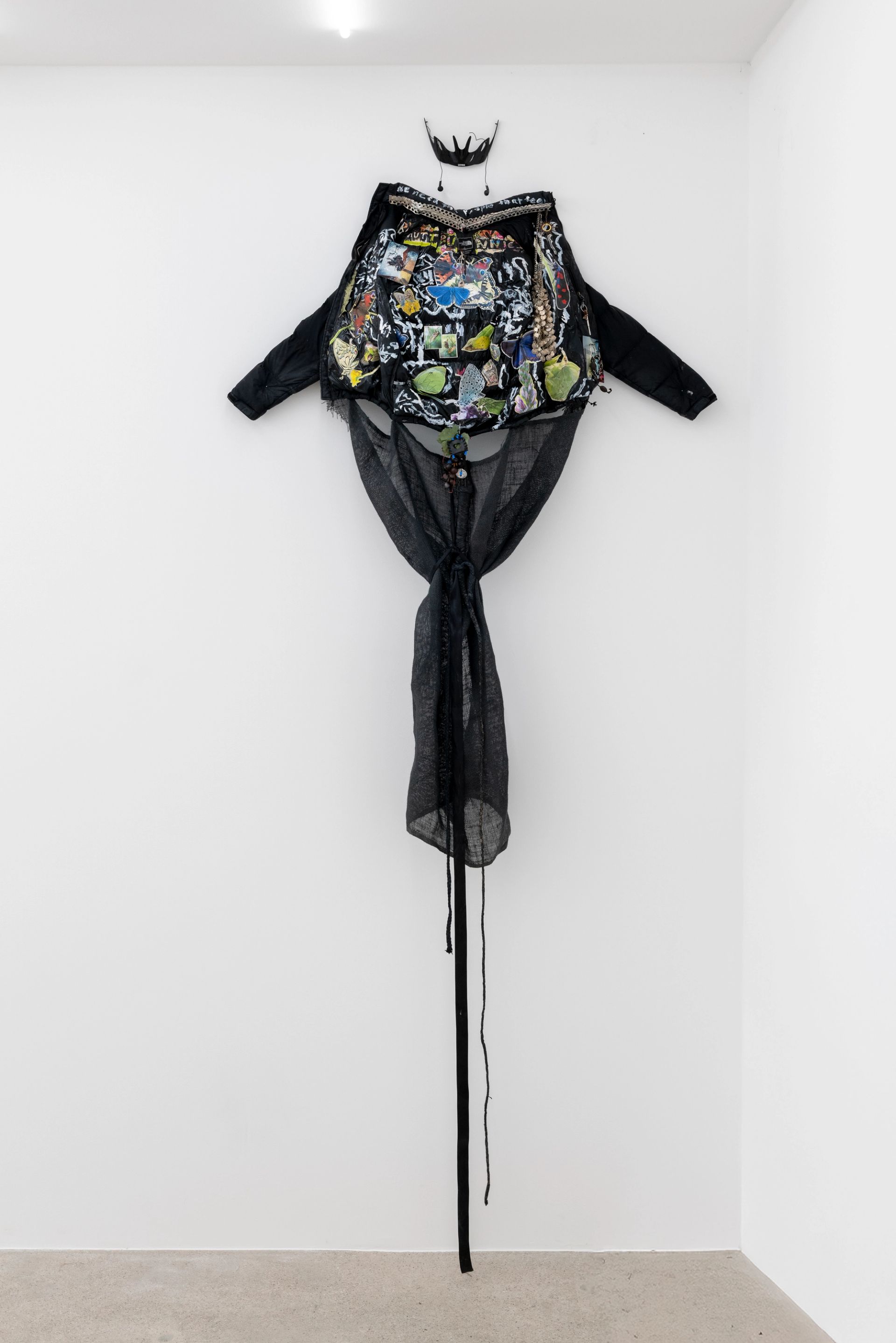 Anna McCarthy, Butterfly, fly away (kite), 2025, acrylic, paper, photograph on Northface jacket, hemp, leather, mixed media, 220 × 140 × 25 cm, dimensions variable
