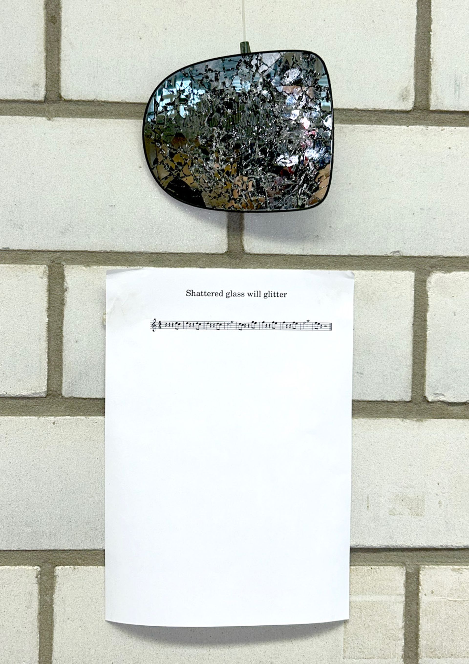 Anna McCarthy, Shattered glass will glitter, 2024, Car mirror, pen on paper, 45 × 21 × 2 cm