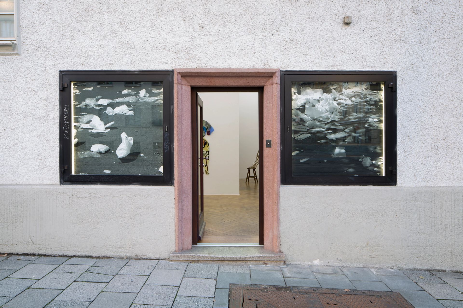 Gallery Entrance with works from the series “A promise of happiness” by Maddy Arkesteyn, 2008, Canson Rage b/w photography on dibond, each 115 × 115 cm