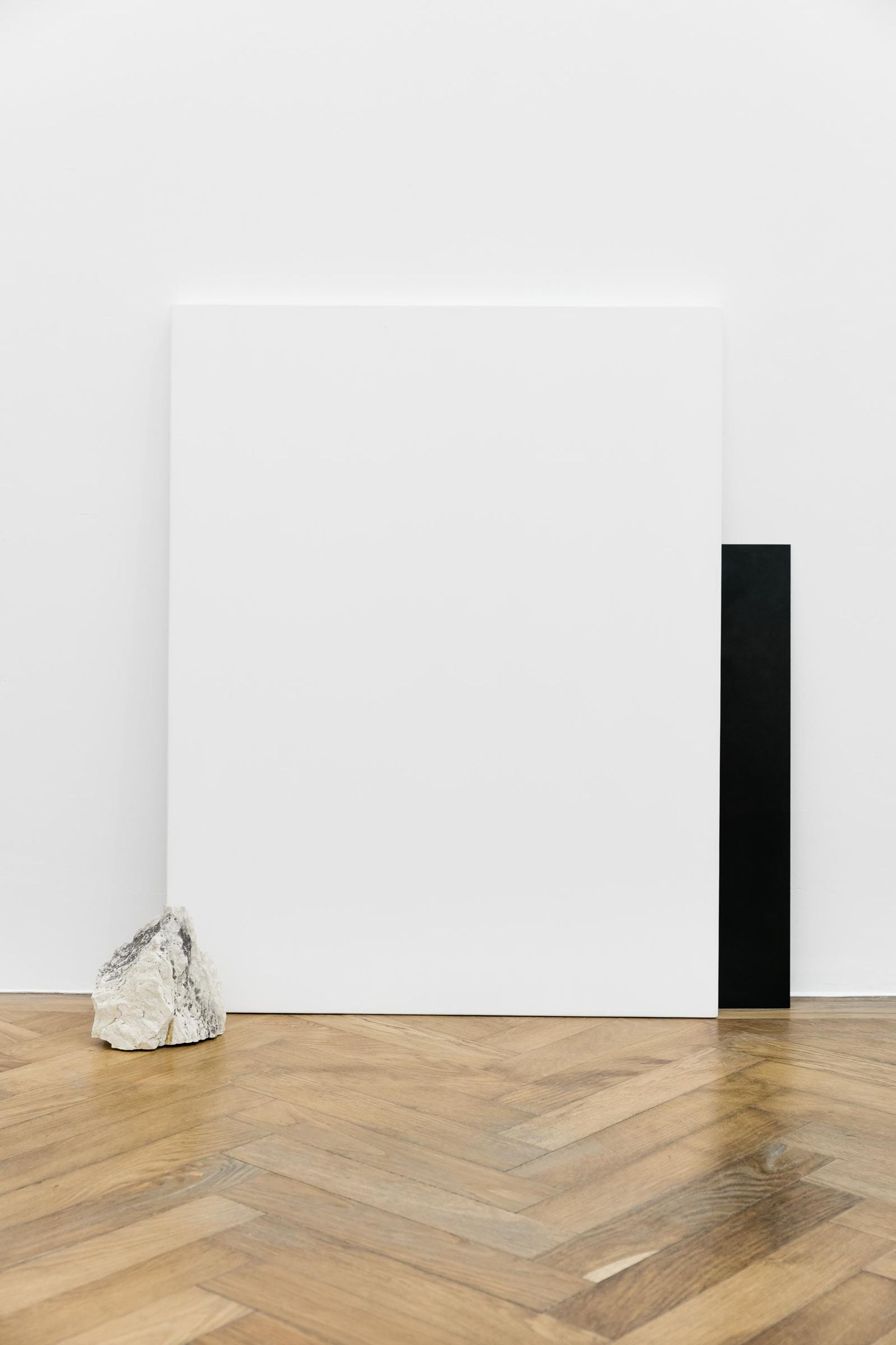 Haris Epaminonda, Untitled #02 t/f, 2014, white pastellone (90 x 70cm), iron plate (60 x 40cm), stone (18 x 16 x 9,5 cm) 